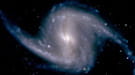 Zoomed-in view of the Dark Energy Camera of the barred spiral galaxy NGC 1365, in the Fornax cluster of galaxies, which lies about 60 million light years from Earth.