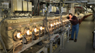 Technician Mike Myers checks components of stochastic cooling "kickers."