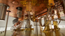 A researcher works on the cryostat unit for CUORE during the assembly process.