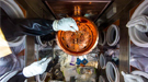 Researchers work on the delicate wiring of a cryostat, which is like a thermos under vacuum that chills the detectors that are the heart of the MAJORANA DEMONSTRATOR.