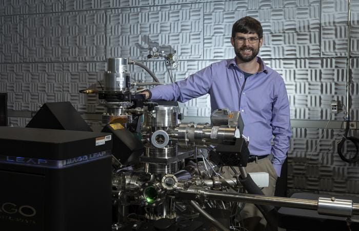 Jon Poplawsky of Oak Ridge National Laboratory combines atom probe tomography (revealed by this LEAP 4000XHR instrument) with electron microscopy to characterize the compositions, structures, and functions of materials for energy and information technologies. Credit: Carlos Jones/Oak Ridge National Laboratory, U.S. Dept. of Energy