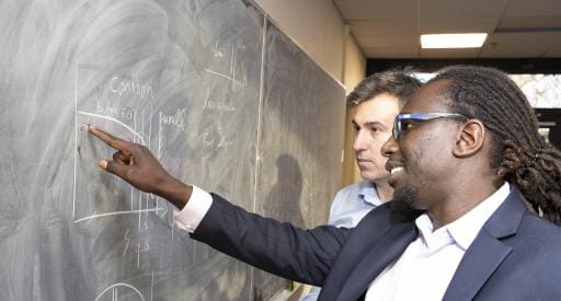 Physicists Ahmed Diallo, front, and Julien Dominski.