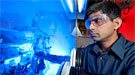 Jagjit Nanda is shown in the research lab with the controlled environment for the fabrication and assembly of lithium-ion battery cells.