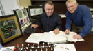 John Shanklin, biochemist at Brookhaven National Laboratory, and Ed Whittle, research assistant in Shanklin's lab, with a fatty acid molecule model and plant seeds and casings in the foreground.