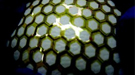 Showcasing the flexible and stretchable thin film transistor array covering a baseball shows the mechanical robustness of this backplane material for future plastic electronic devices.