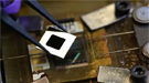 A nanophotonic solar thermophotovoltaic device composed of an array of multi‑walled carbon nanotubes as the absorber, a one‑dimensional silicon/silicon dioxide photonic crystal as the emitter, and a 0.55 eV photovoltaic cell.