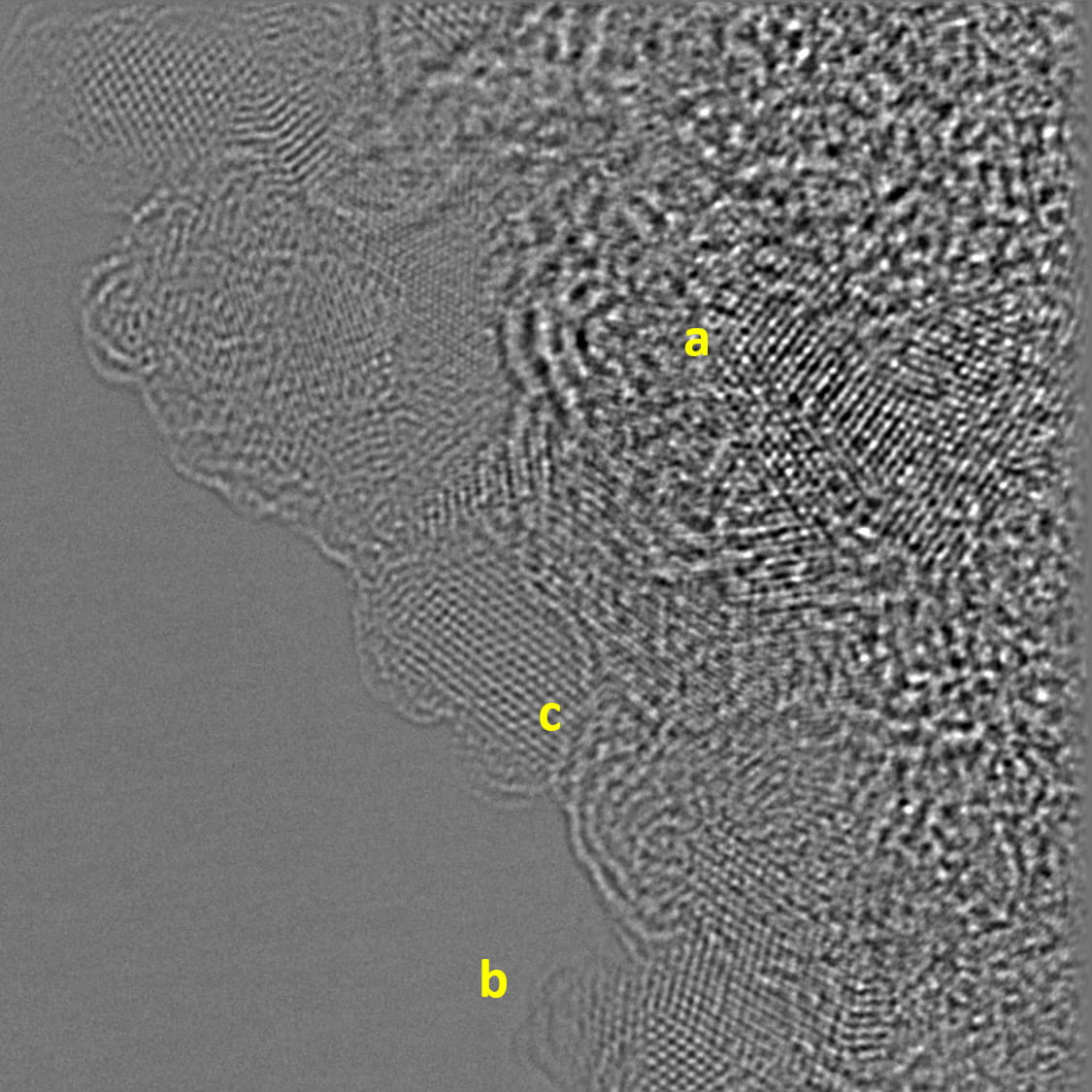 Dark gray background with liquid like mass on the right half and three pindots of yellow.